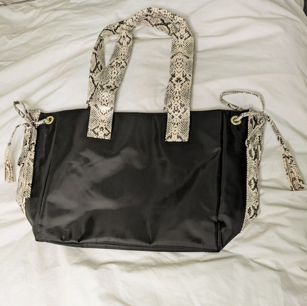 Large Guang Tong handbag with snake-skin print handles and trim.